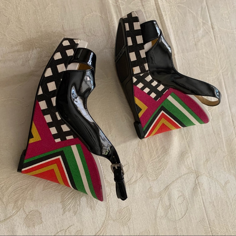 Nine West patent leather sling back platforms.